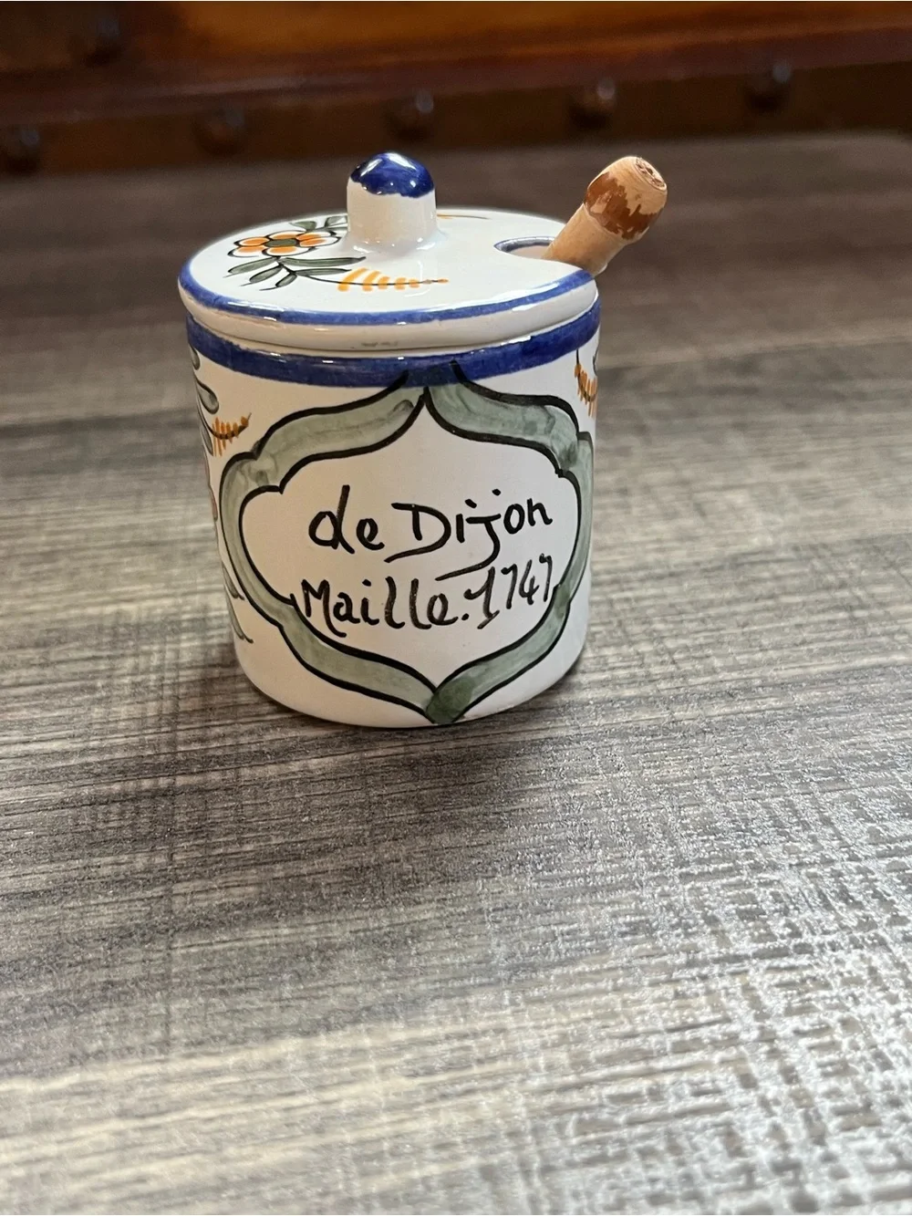 Small homemade French hand painted mustard jar with wooden spoon. Ceramic